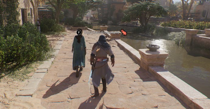Die Option zum Taschendiebstahl in Assassin's Creed Mirage wird bei möglichen Zielen eingeblendet.