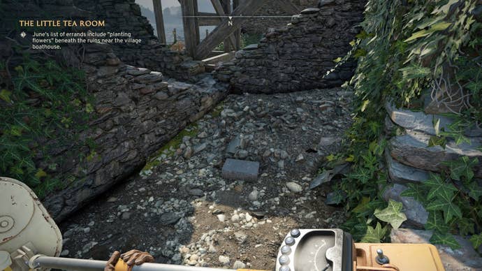 The player looks at a cache - discovered by a metal detector - by the Wyndham Village Boathouse in Atomfall