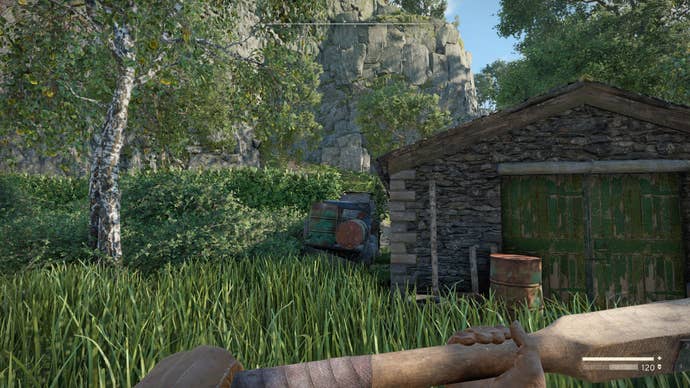 The player looks at the gap between Datlow Hall’s garage and a broken down car in Atomfall