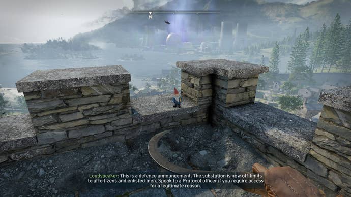The player looks at a gnome sat on top of St. Katherine’s Church in Wyndham Village in Atomfall