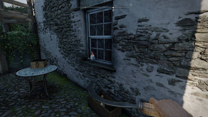 The player looks at a gnome sat on a window sill in Wyndham Village in Atomfall