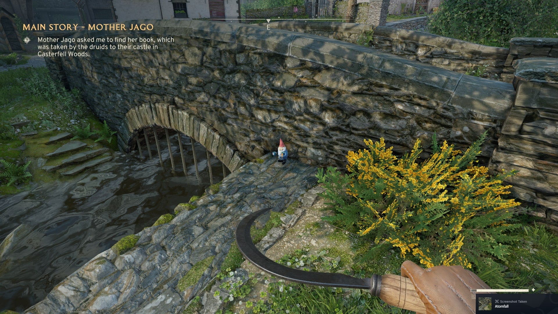 The player looks at a gnome sat next to the bridge in Wyndham Village in Atomfall - 11