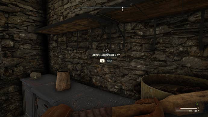 The player looks at the Greenhouse Hut Key hanging from a kitchen shelf in Atomfall