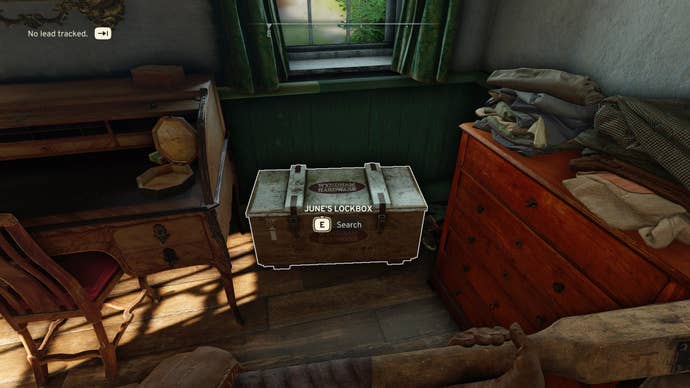 The player loots June’s Lockbox inside of the Wyndham Village Hall, using June’s Key, in Atomfall