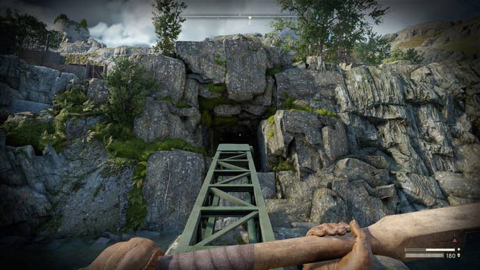 The player faces a cave inside of a quarry in Slatten Dale, in Atomfall