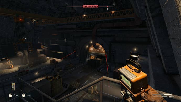The player looks towards the door to Robotics inside of the Interchange in Atomfall