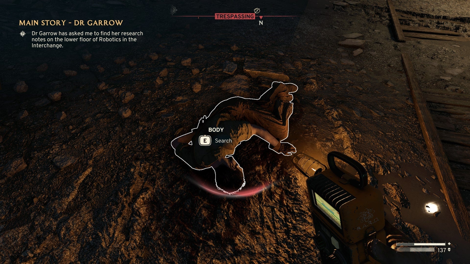 The player looks down at a corpse who holds the Site Office Key in Atomfall - 7