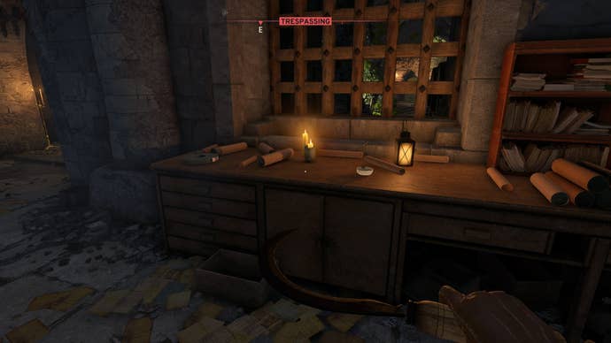 The player looks at a desk where the Strange Tonic Recipe and some spores can be found in the Castle Ruins in Atomfall
