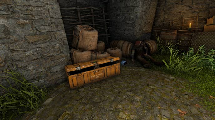 The player looks at an open BARD Crate beside a Druid corpse in the Druid’s Castle Ruins in Atomfall