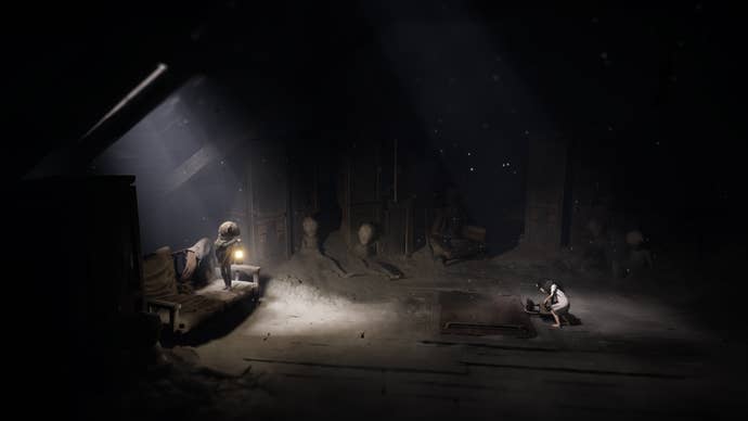 A Reanimal screenshot showing two children in a gloomy, ash-covered attic. The girl examines a padlocked hatch in the floor while the boy watches with his lantern aloft.