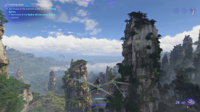The player flies through tall mountains in Avatar: Frontiers Of Pandora