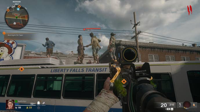 A player looks at zombies dancing on the roof of a bus in Liberty Falls in Call of Duty: Black Ops 6