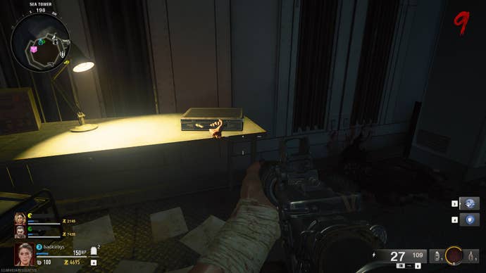 The player looks at a suitcase with a severed hand attached to it on a desk on Terminus in Call of Duty: Black Ops 6