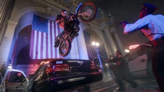 Official Call of Duty: Black Ops 6 screenshot showing Adler jumping a dirt bike over a car in front of an American flag