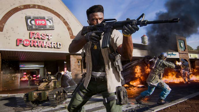 Official Call of Duty: Black Ops 6 screenshot showing a multiplayer image of a player shooting a gun in front of a burning video tape rental store