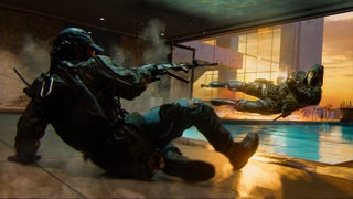 Official Call of Duty: Black Ops 6 screenshot showing one player sliding and shooting at another diving sideways into a pool