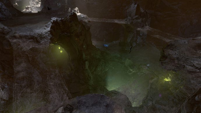 Baldur’s Gate 3 image showing a pit to the Underdark, illuminated with a faint green glow.