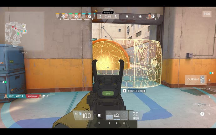 The player character aims their sights at a glowing yellow barrier, which is one of the game's abilities.