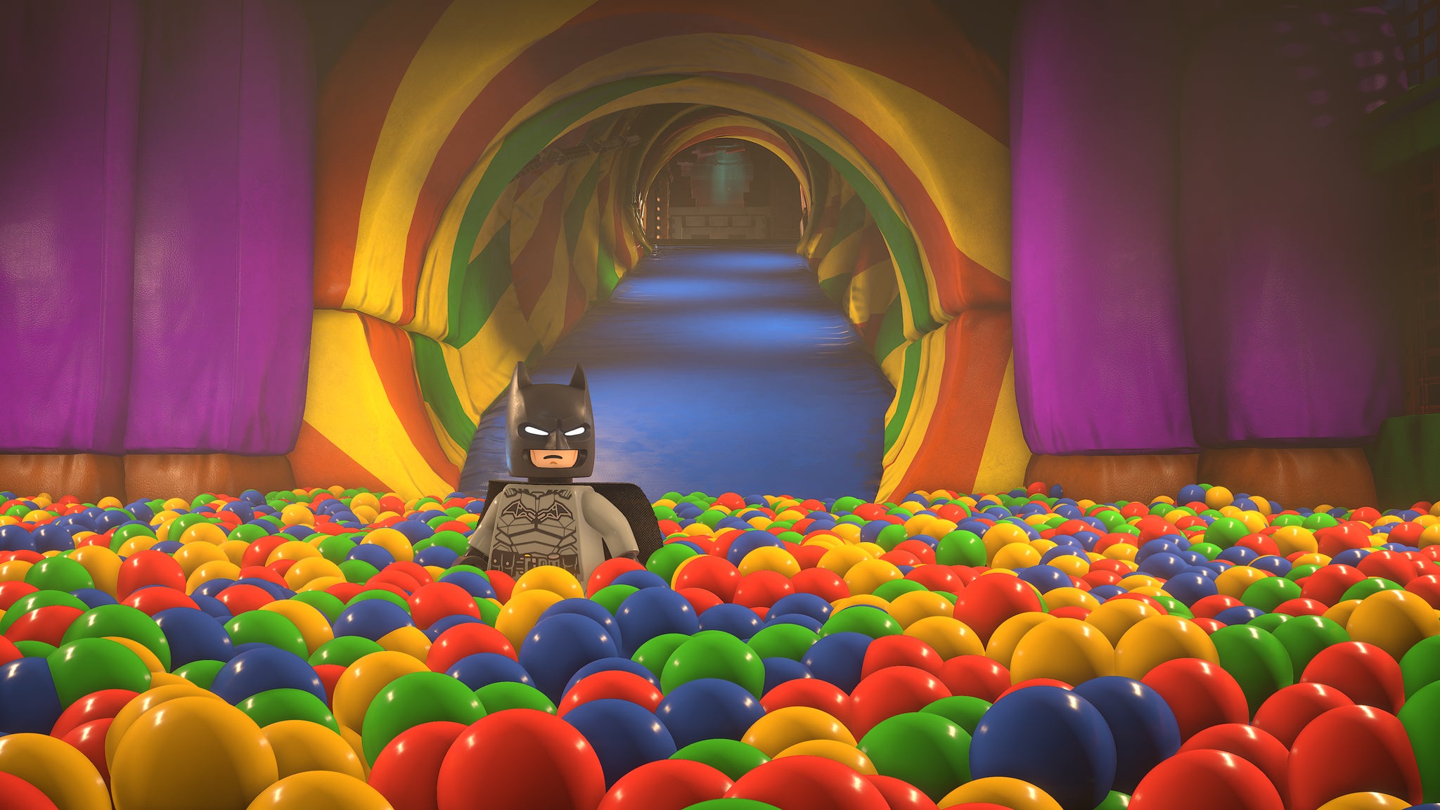 Batman stands in a ball pit in Lego Batman Legacy of the Dark Knight