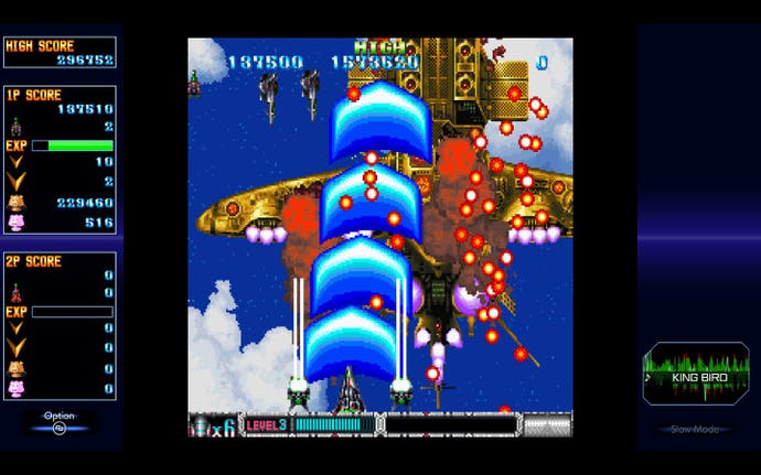 Batsugun Saturn Tribute Boosted review screenshot, showing the player ship destroying a large energy spacecraft realised in the Toaplan design tradition.