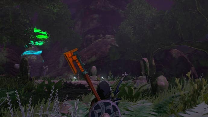 Link standing in a darkly lit wooded area in The Legend of Zelda: Tears of the Kingdom.