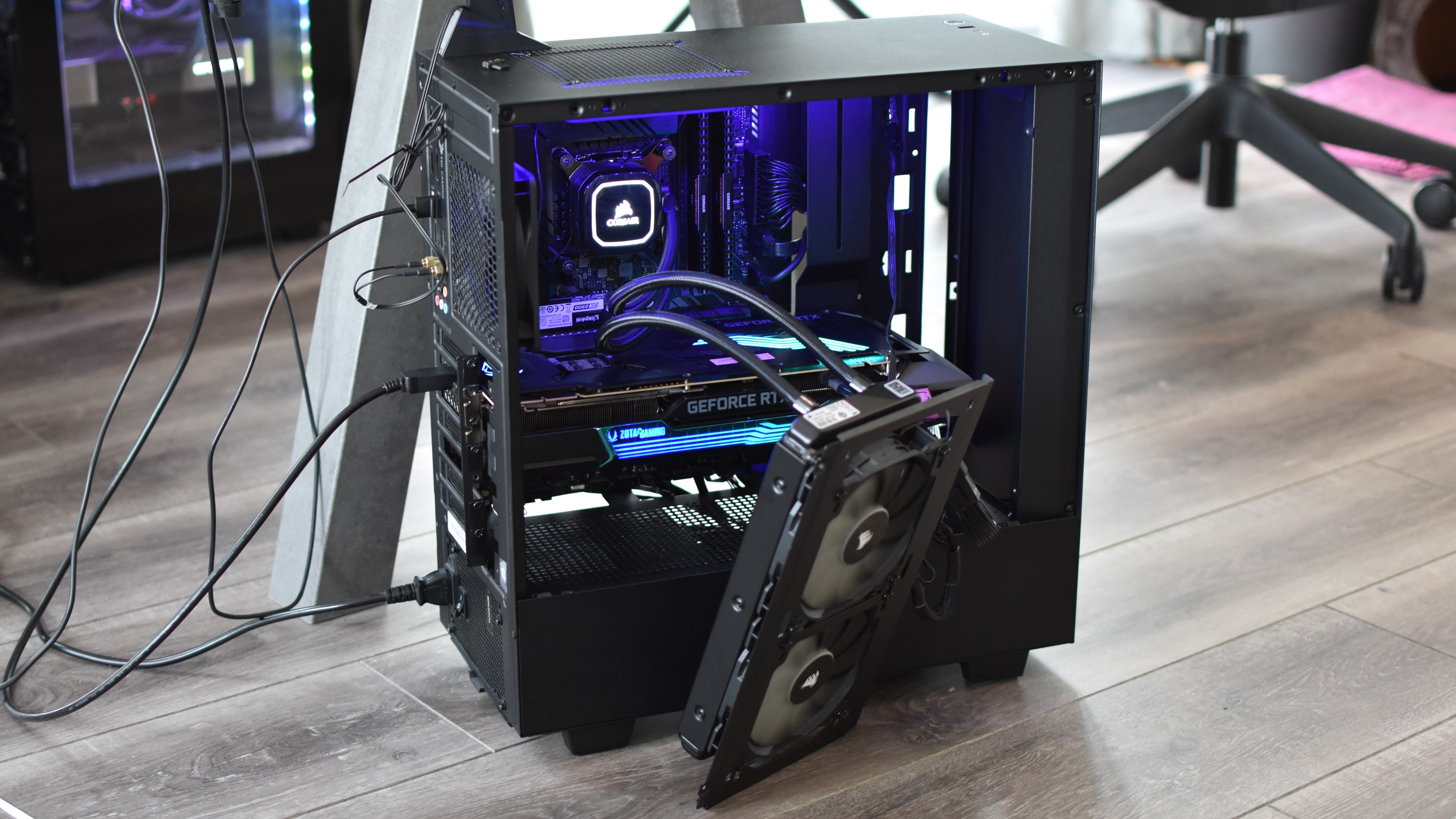 A gaming PC with its CPU cooler radiator stood outside the case, as a result of the graphics card being too big to fit inside at the same time.