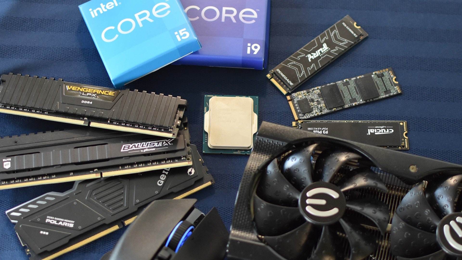 Various PC components (and one gaming mouse) arranged in a circular pattern.