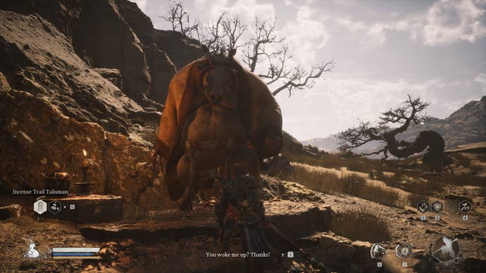 The player speaks to a drunk Boar in Black Myth Wukong
