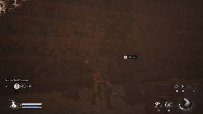 The player looks at a cracked wall they can enter in Black Myth Wukong