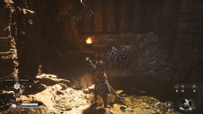 The player approaches the Man in Stone in Black Myth Wukong