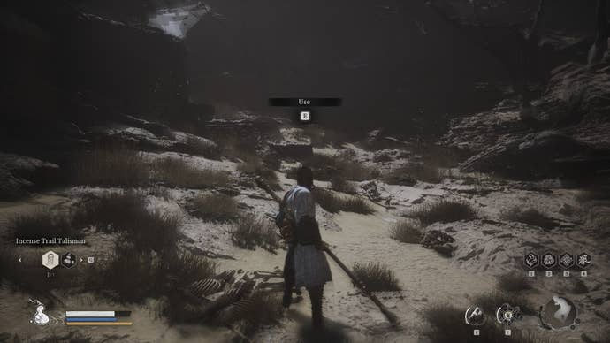 The player uses an old drum rattling at a well in Sandgate Village in Black Myth Wukong