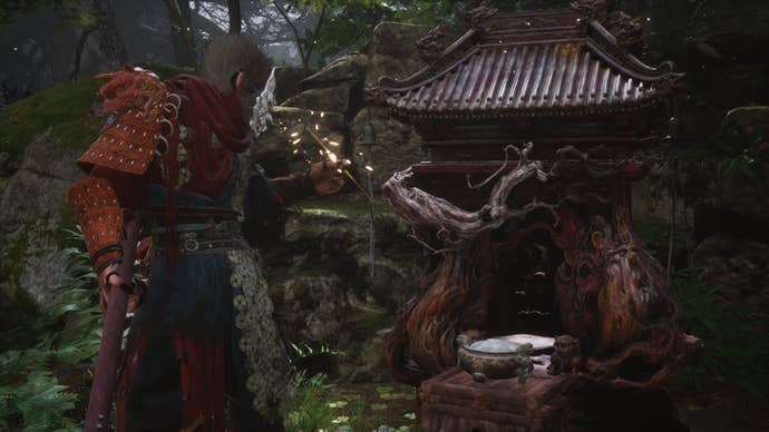 The player lights some incense at a Keeper’s Shrine in Black Myth Wukong