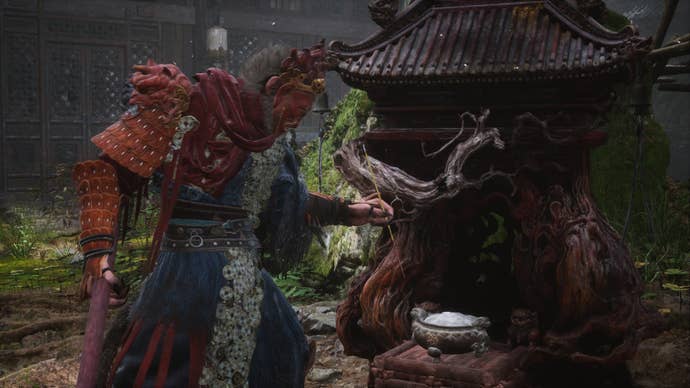 The player lights incense at a Keeper’s Shrine in Black Myth Wukong