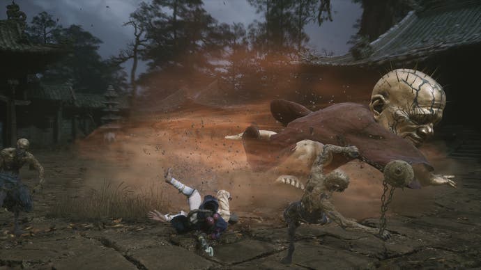 Black Myth: Wukong screenshot showing monkey being hit by giant enemy with huge bald head