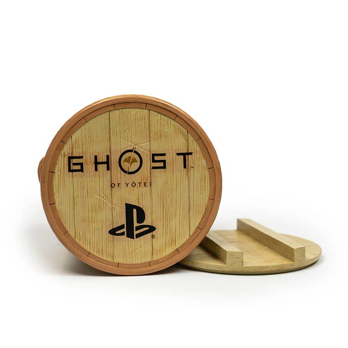 Bottom of the Ghost of Yotei popcorn bucket with the PS logo and the game's name printed on the base