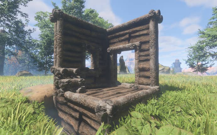 A demonstration of the Tarred Wood Block, made of large dark logs.