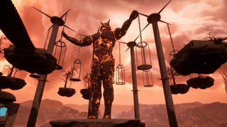 Chained Together screenshot showing a large demonic statue in the middle of hell