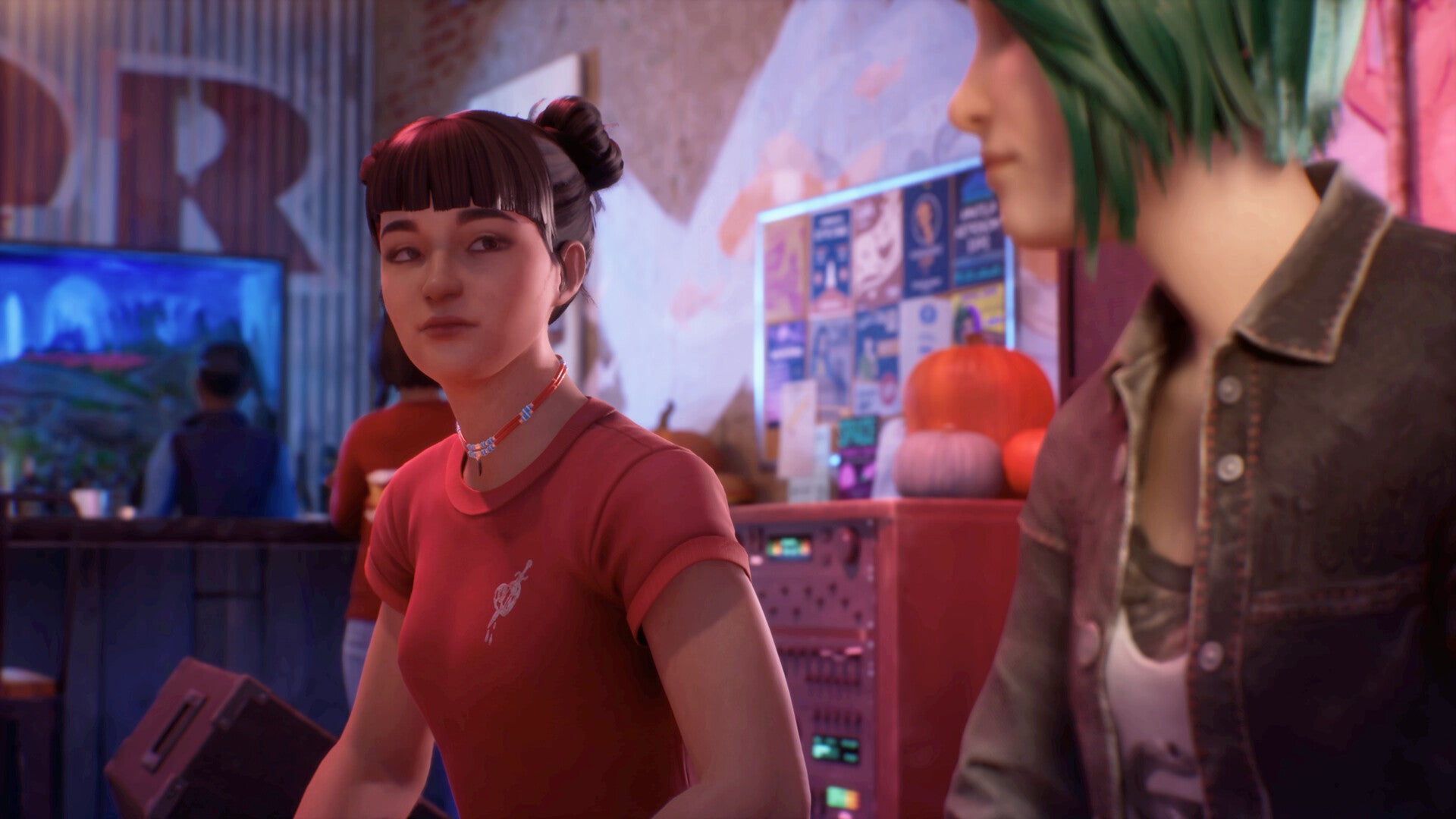 Chloe talks with a dark haired female in a red top in Life is Strange Reunion