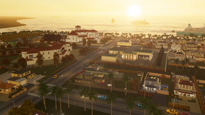A Cities: Skylines 2 town at sunset, showing various buildings added in the Beach Properties asset pack.