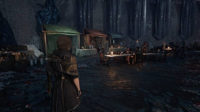 Gustave looks over at the three vendors and other NPC’s at the Expedition Festival in Clair Obscur: Expedition 33
