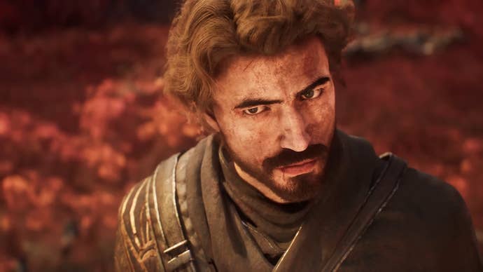 Clair Obscur trailer screenshot showing close up on Gustave, with floppy hair and moustache in a grim red environment