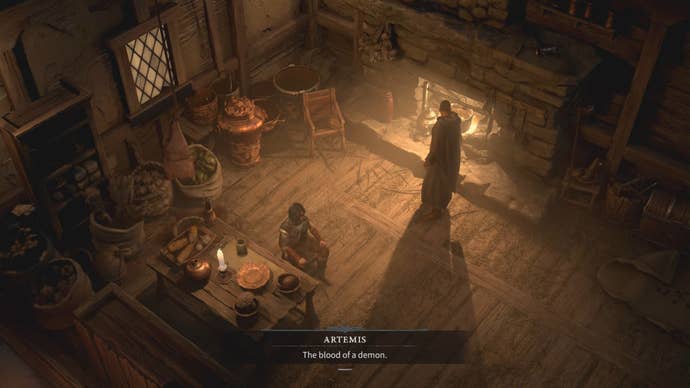 Inside a hunter’s cabin, fire in a hearth illuminating the room. One figure sits at a table eating, another paces by the fire.