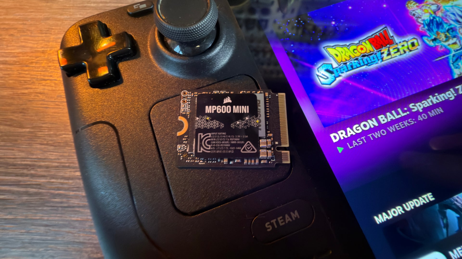 The Corsair MP600 Mini SSD, sat on top of a Steam Deck.