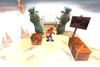 Crash approaches a bridge marked with a 'danger' sign in Crash Bandicoot