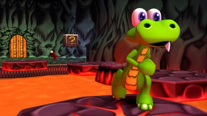 A Croc: Legend of the Gobbos remaster screenshot showing the cartoon crocodile naivgating rocky platforms surrounded by lava.