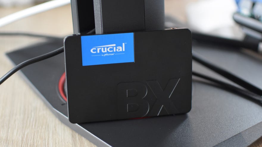 The Crucial BX500 SSD propped up on a desk.