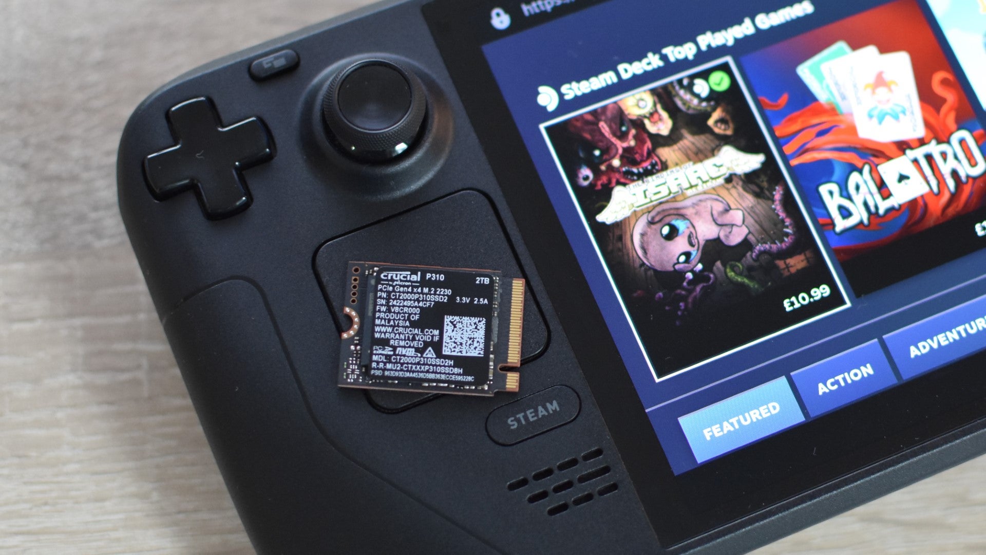 The Crucial P310 SSD on top of a Steam Deck OLED. - 9