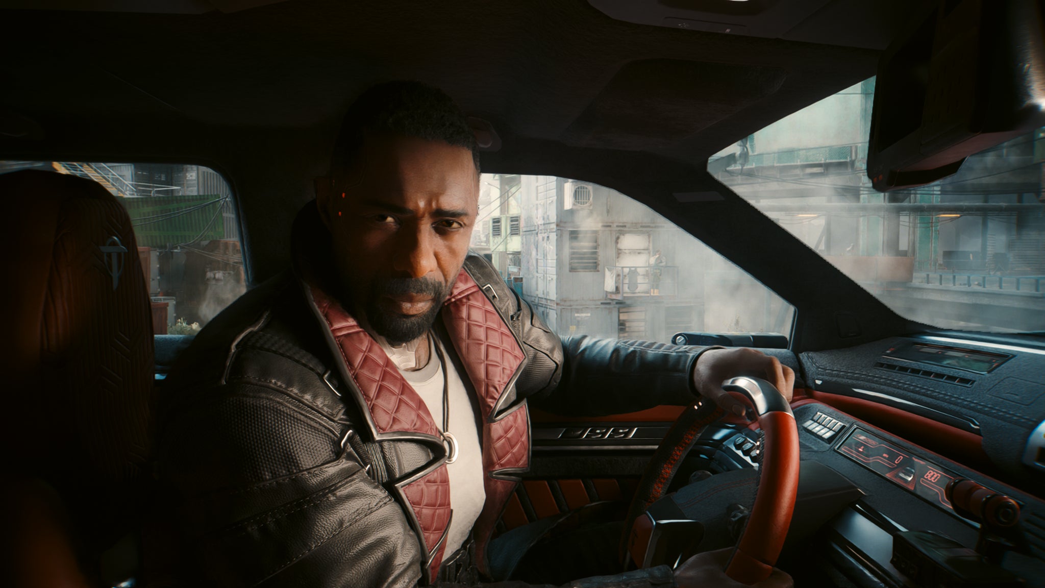 Idris Elba's Solomon Reed sits in a car, looking at the player, in Cyberpunk 2077: Phantom Liberty. - 5