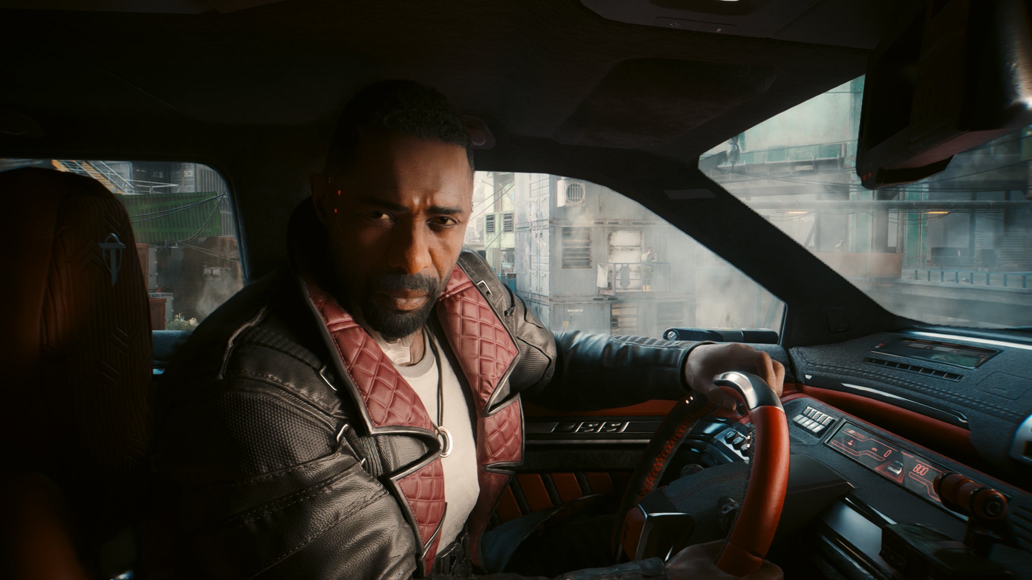 Idris Elba's Solomon Reed sits in a car, looking at the player, in Cyberpunk 2077: Phantom Liberty. - 1