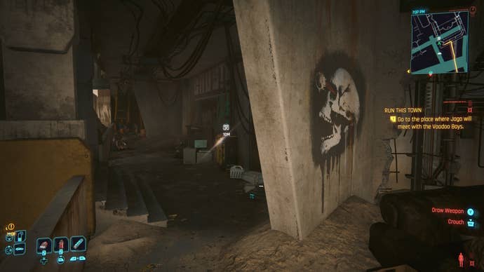 first person view of a yellow restricted data terminal behind a skull graffiti wall